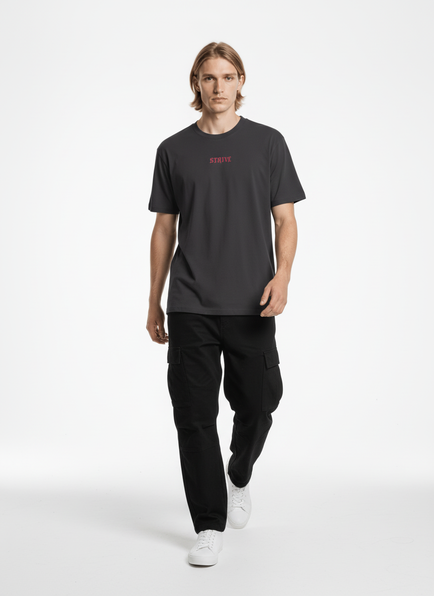 Full body view of the model wearing Strive - Hard As Fu*k - Unisex Marškinėliai